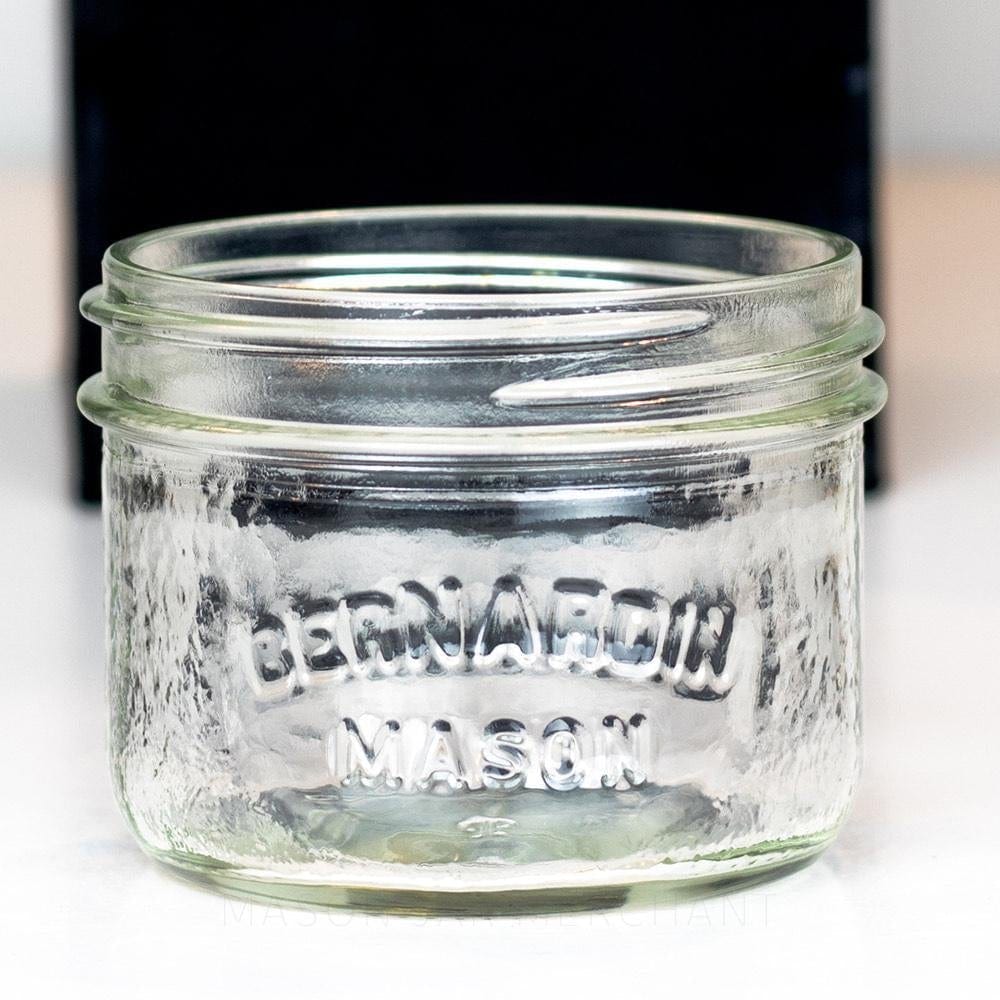 Close-up of Bernardin Mason wide mouth half-pint mason jar against a black background