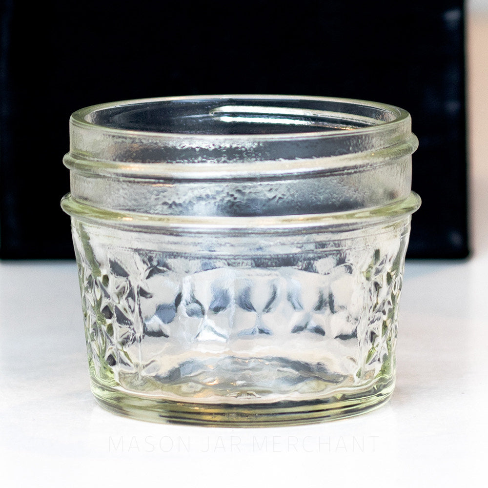 3 oz. regular mouth mason jar with a quilted pattern on a white background
