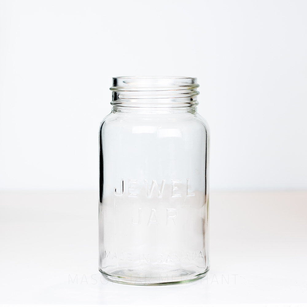 Vintage gem mouth quart mason jar with Jewel Jar logo, on a white background