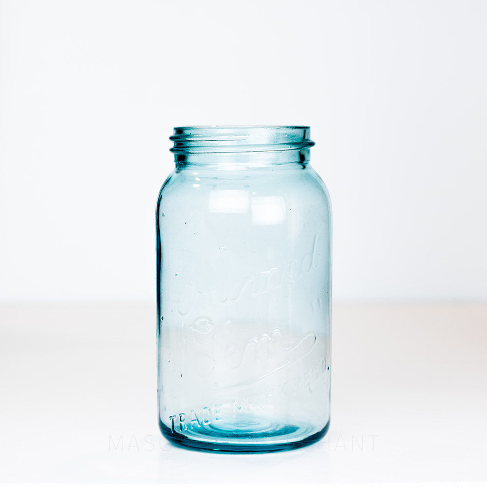 Vintage blue gem mouth 29 oz mason jar with Improved Gem logo on a white background