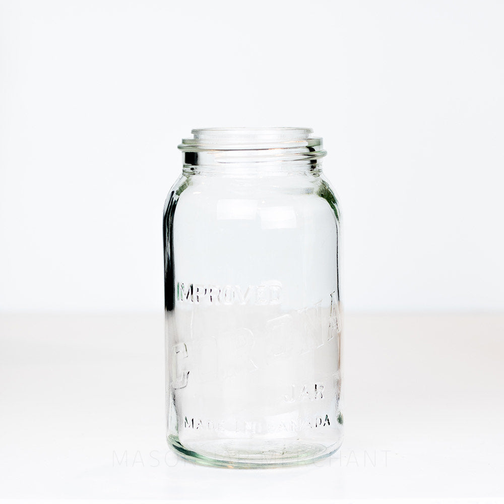 Vintage gem mouth quart mason jar with Improved Corona Jar logo, on a white background