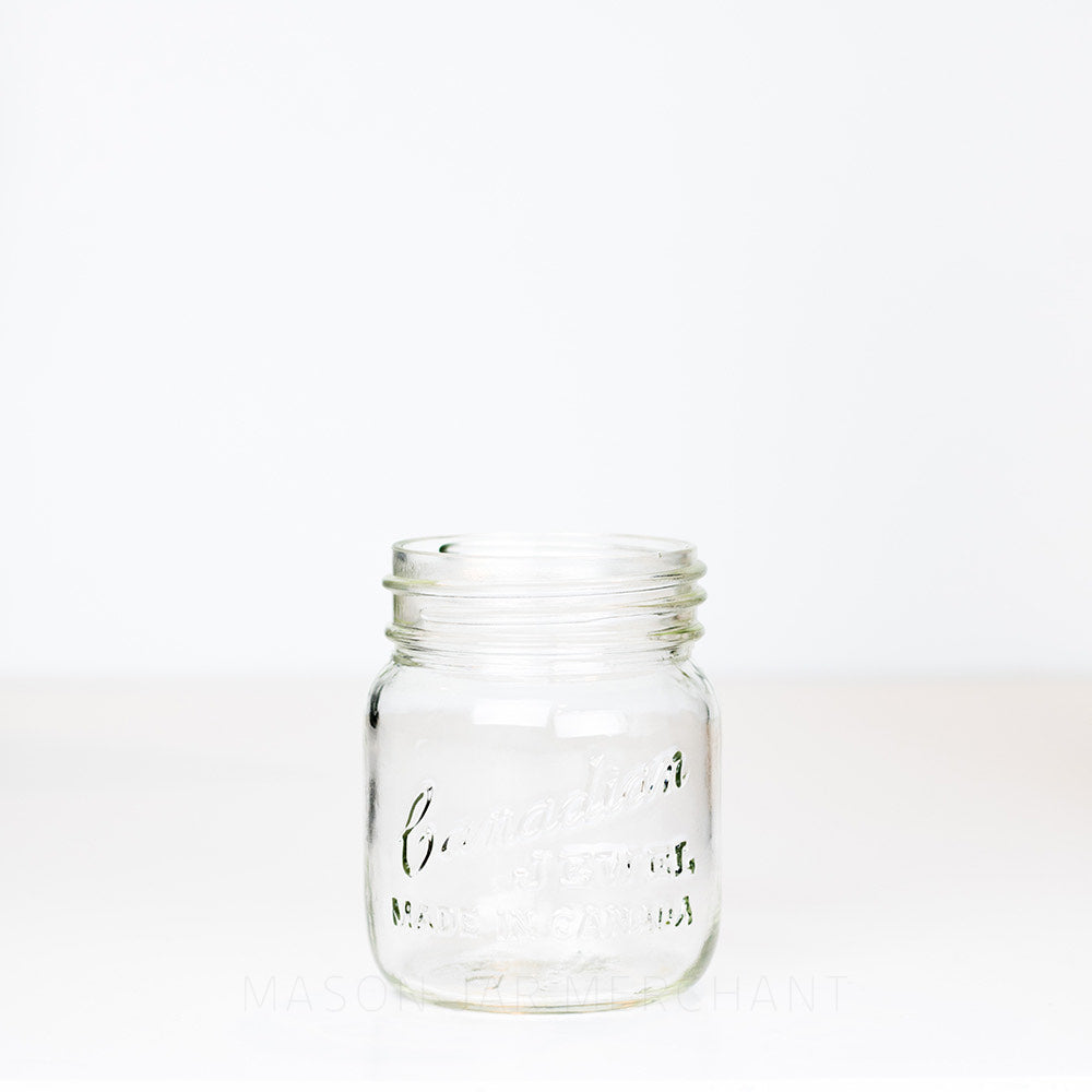 Adorable gem mouth 13 oz mason jar with Canadian Jewel logo, on a white background