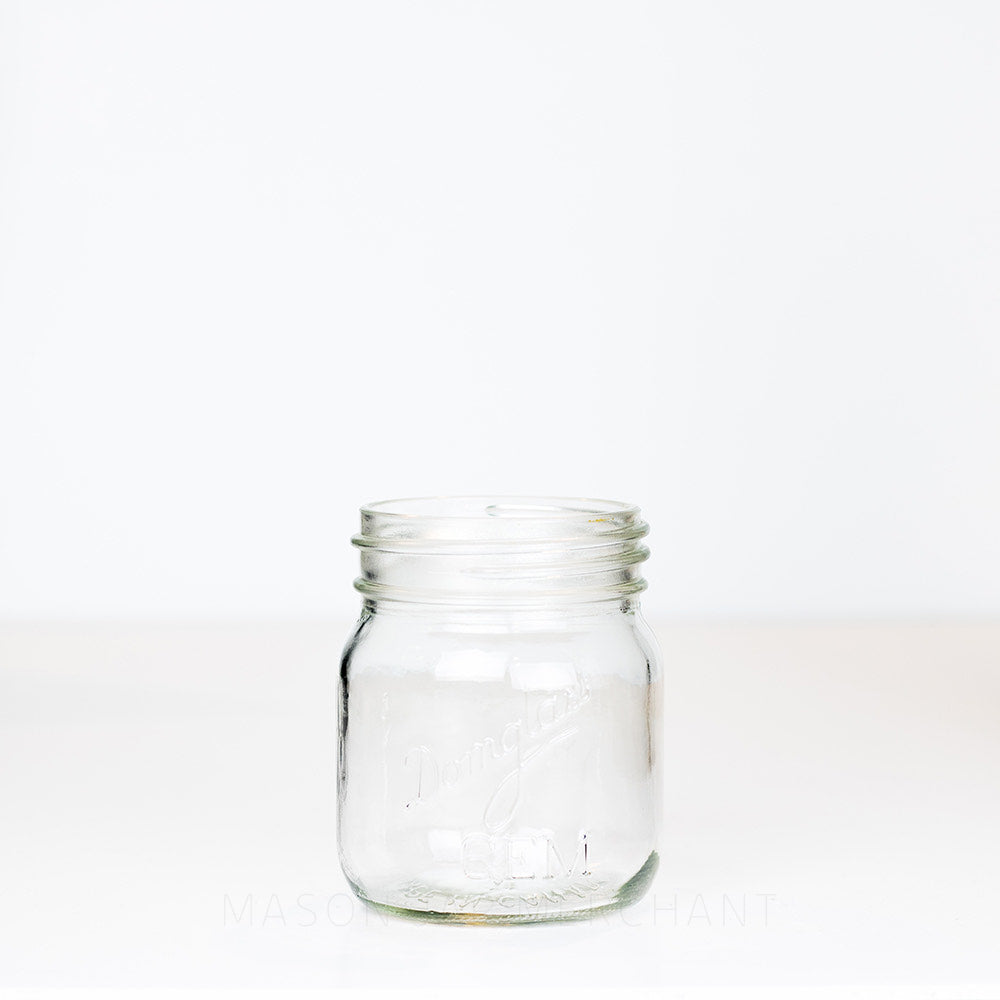 Adorable gem mouth 13 oz mason jar with Domglas logo, on a white background