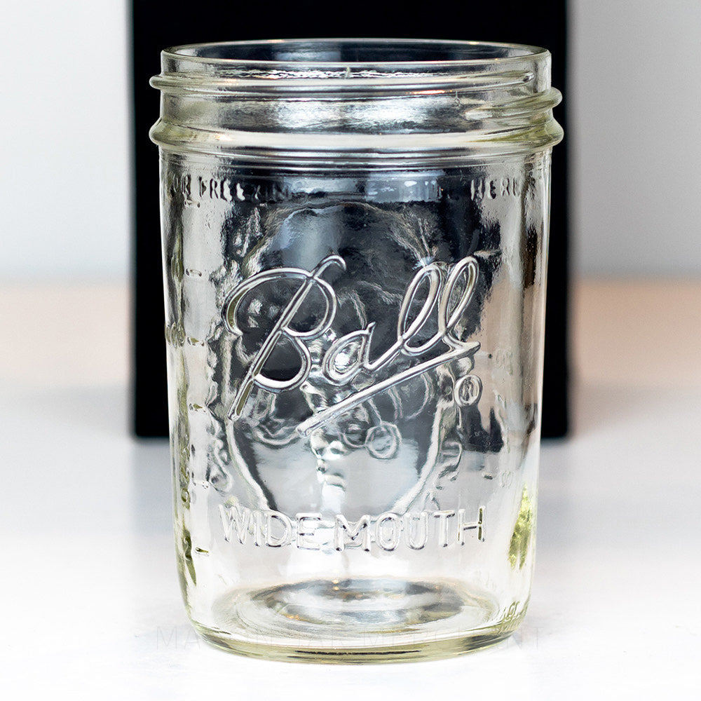 A close up of a Wide mouth pint Ball mason jar against a white background
