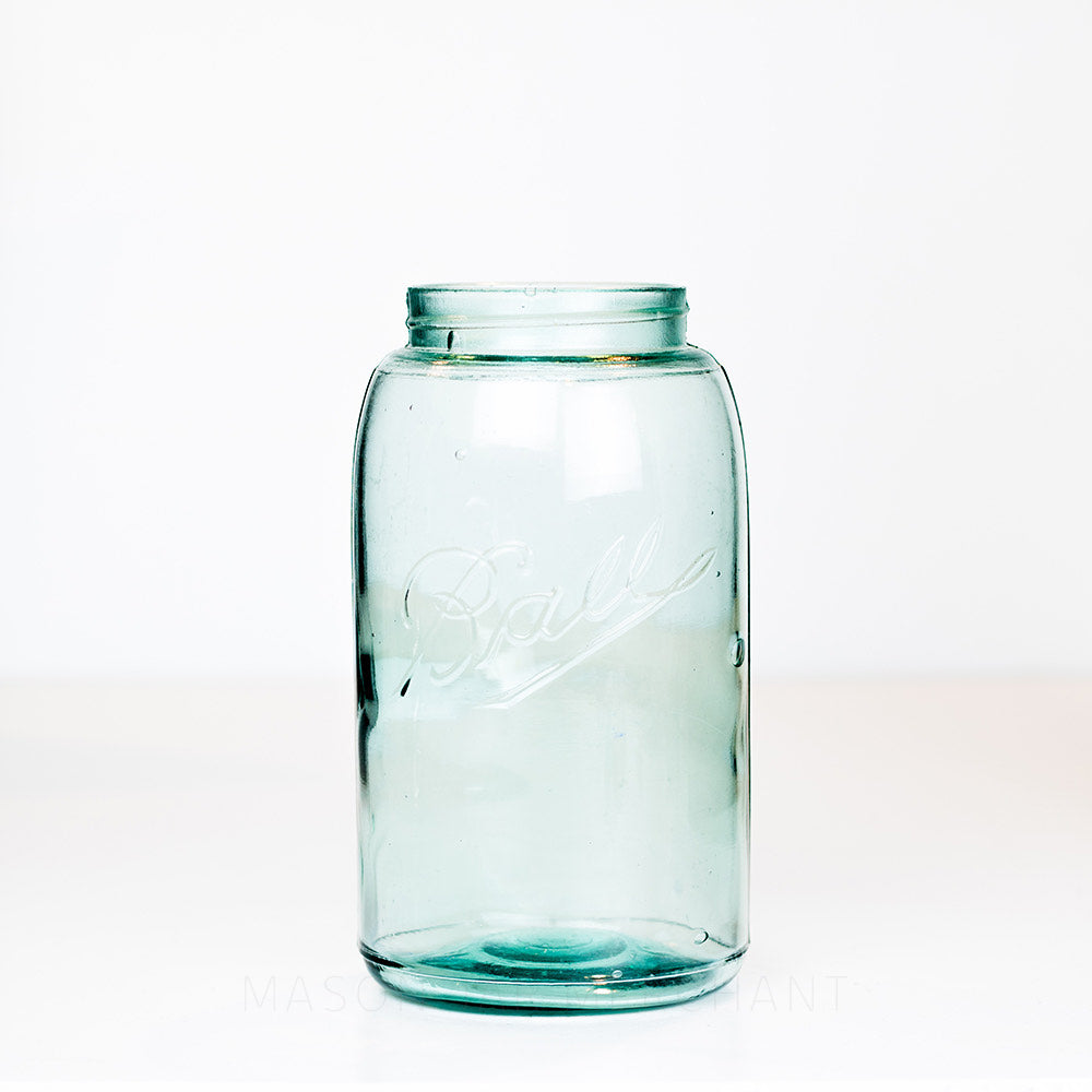 Vintage green-blue Ball regular mouth quart mason jar on a white background 
