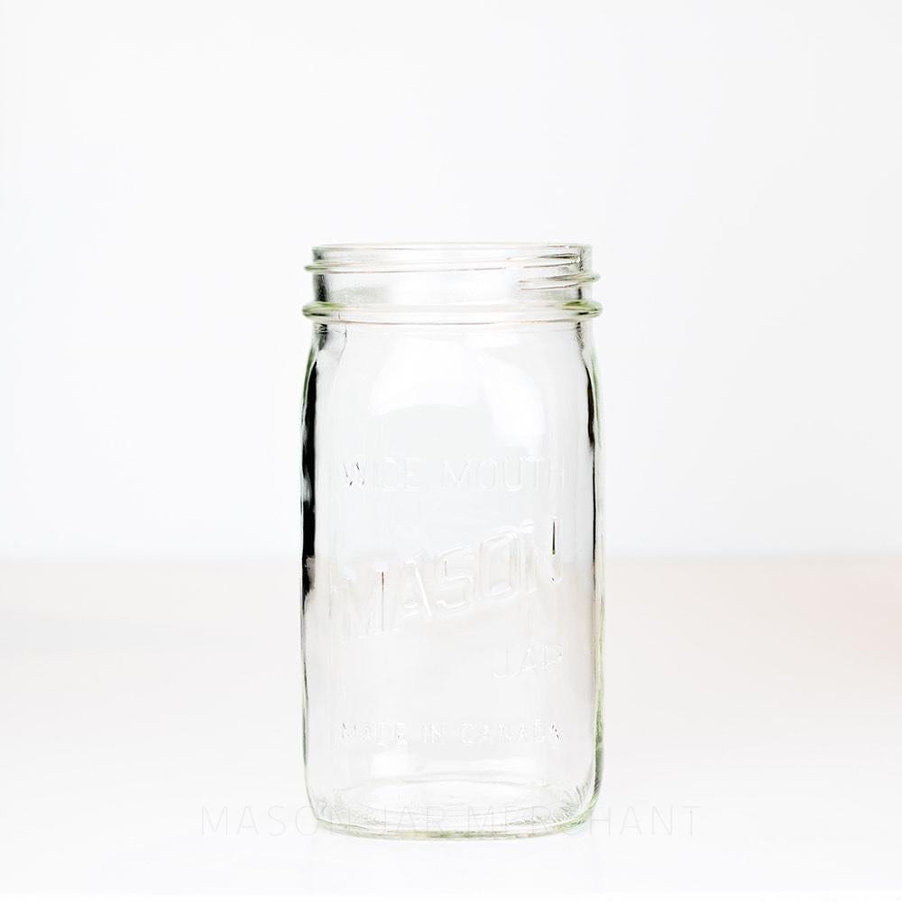 Wide mouth quart mason jar with Mason logo against a white background