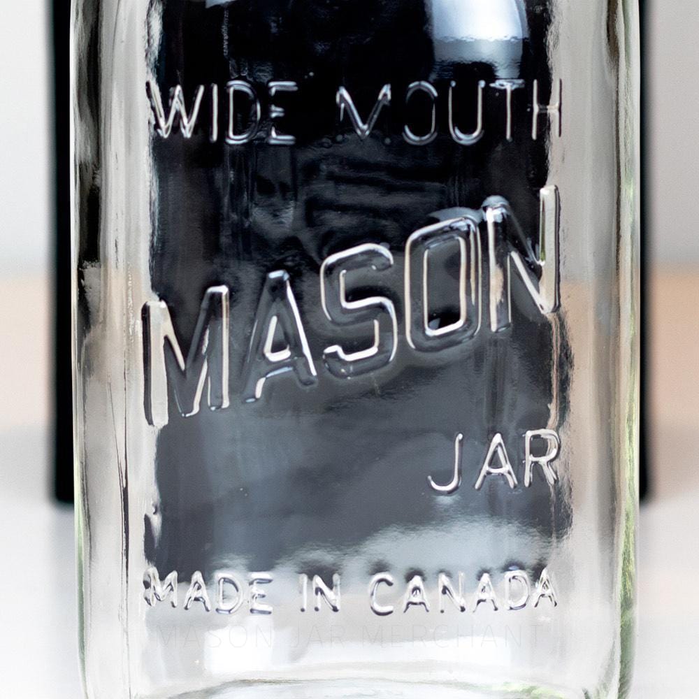 close up of a Wide mouth quart mason jar with Mason logo against a white background