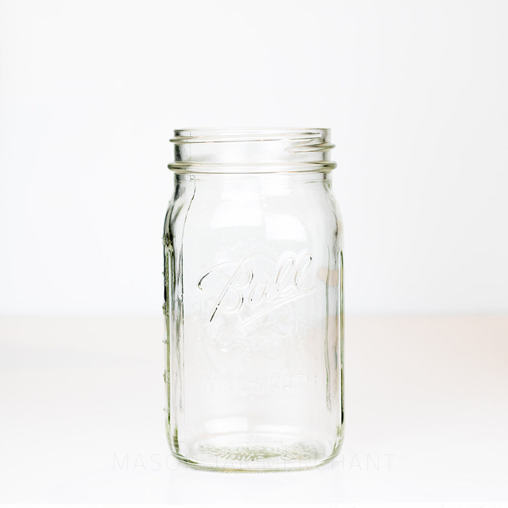 Wide mouth quart mason jar with Ball logo, against a white background 