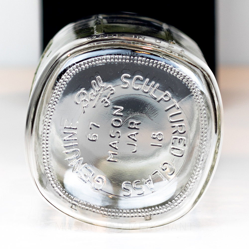 bottom of a Wide mouth quart mason jar with Ball logo, against a white background