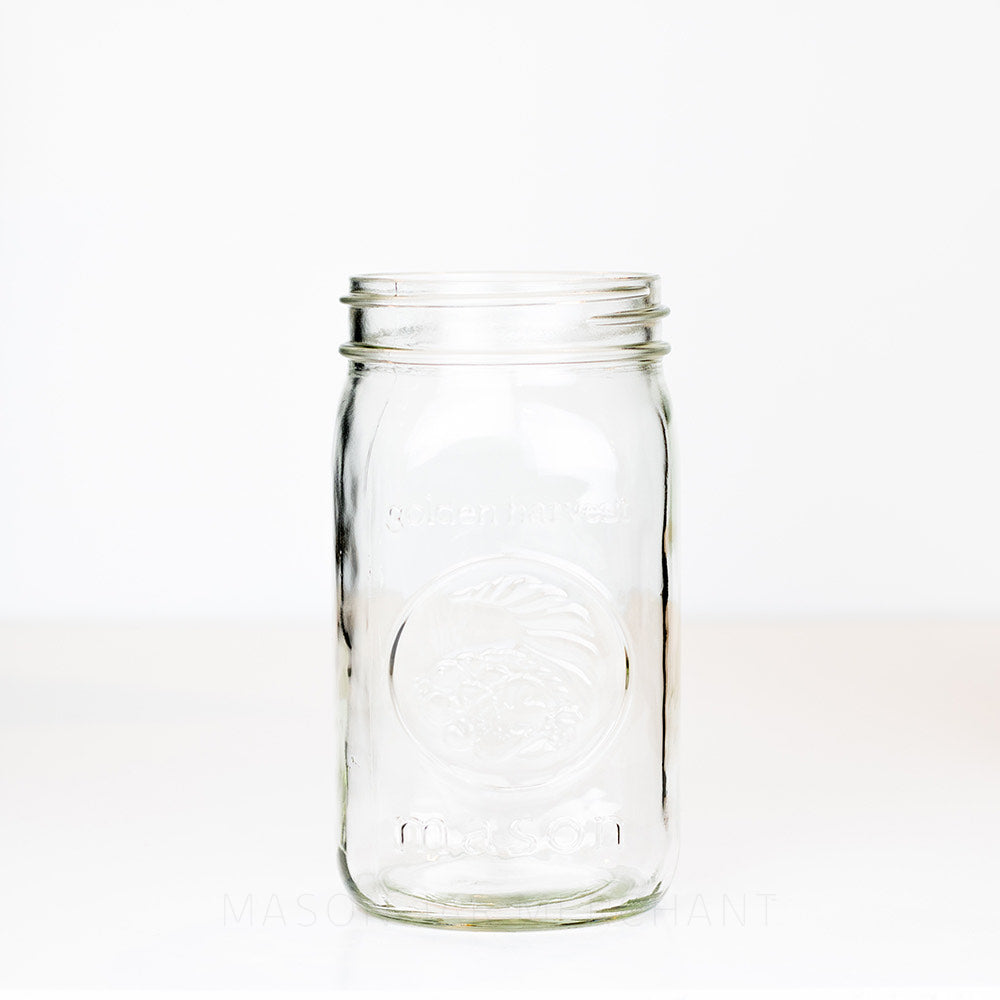Wide mouth quart mason jar with Golden harvest cornucopia  logo on a white background 