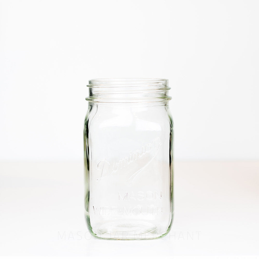 Wide mouth quart mason jar with Dominion Mason logo on a white background