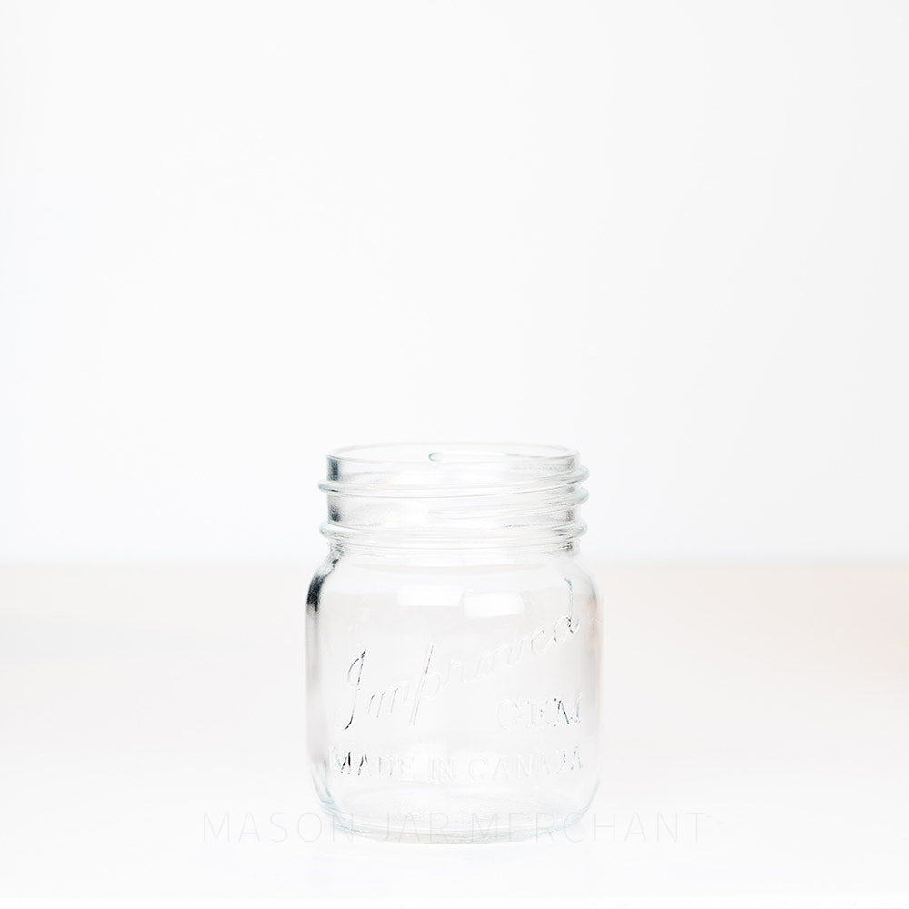 Adorable gem mouth 13 oz mason jar with Improved Gem logo on a white background
