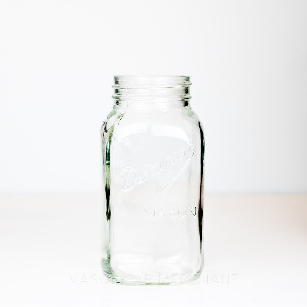 Regular mouth quart mason jar with Dominion Mason logo against a white background 