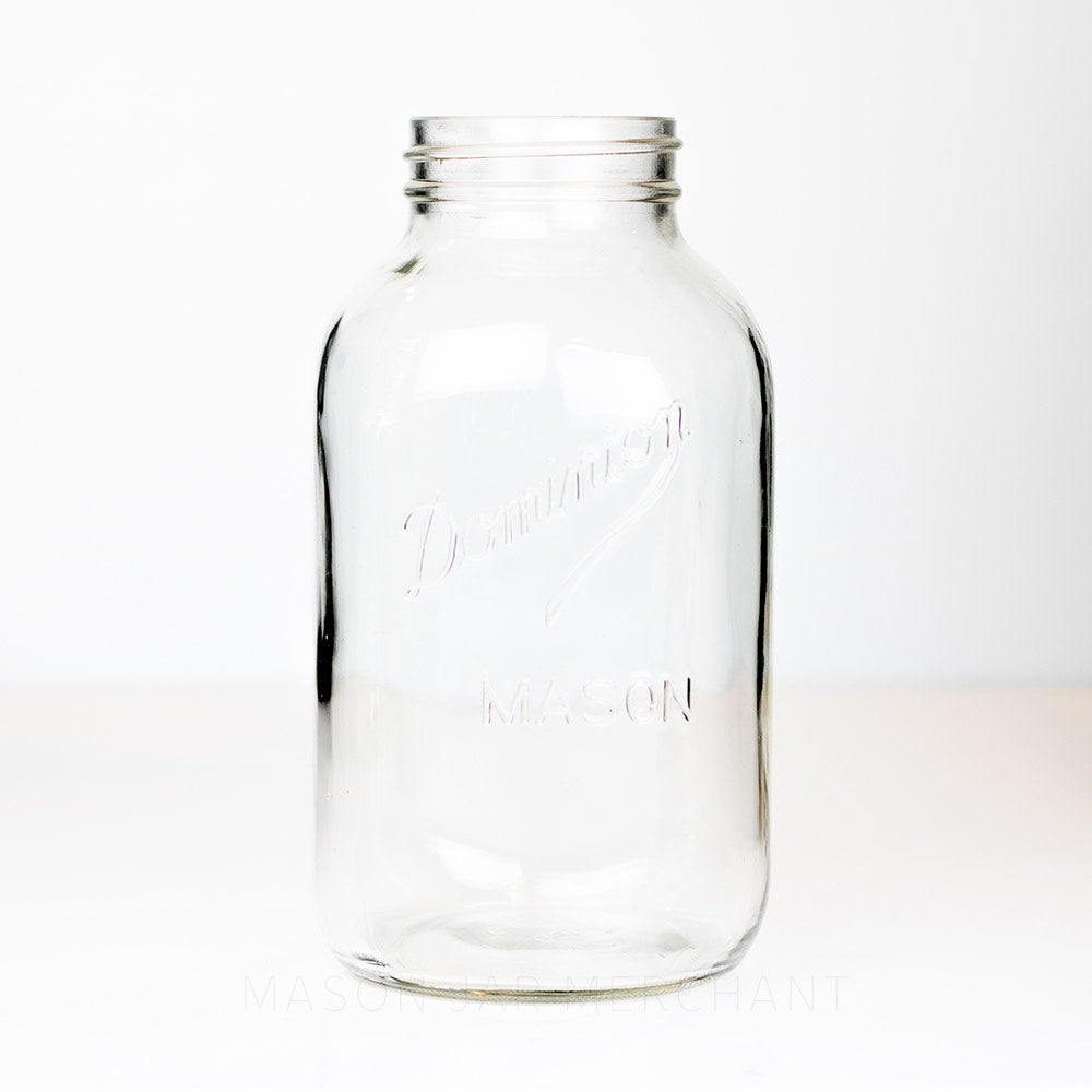 Vintage regular mouth two-liter jar with Dominion logo against a white background.