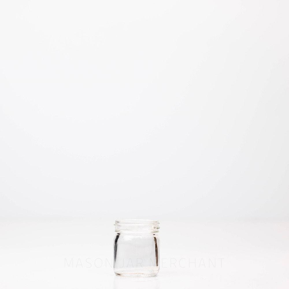 A 1.25 oz Mini Mason Jar against a white background
