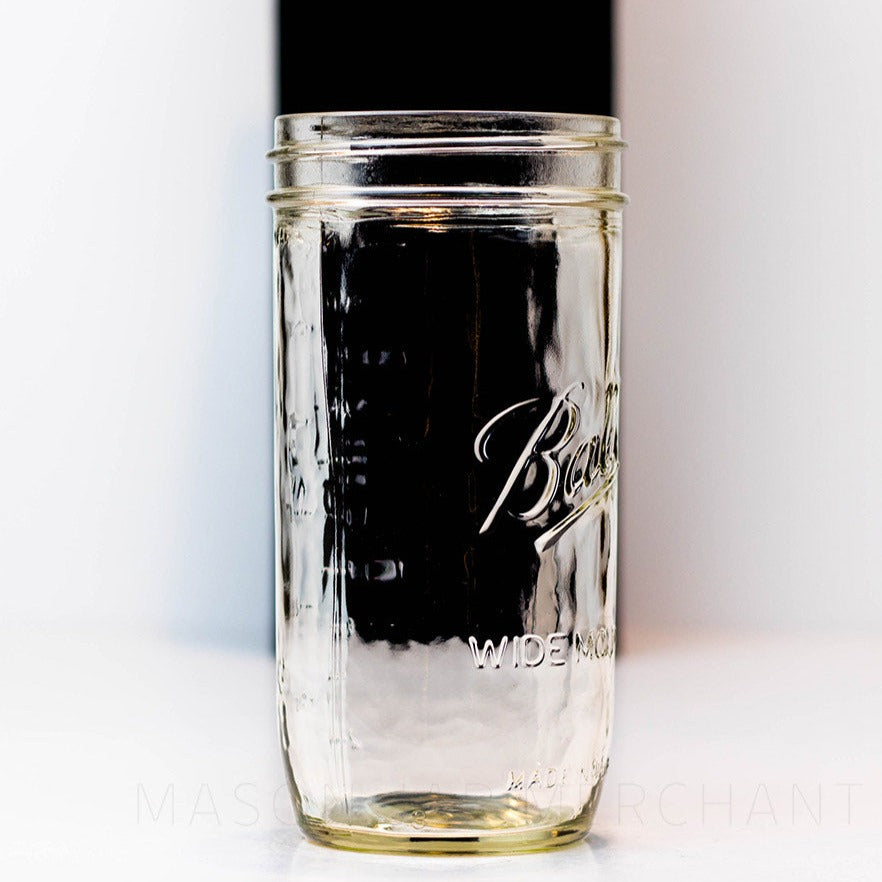 side view of a 24 oz wide mouth Ball mason jar against a white background
