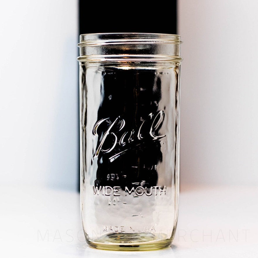 close up of a 24 oz wide mouth Ball mason jar against a white background