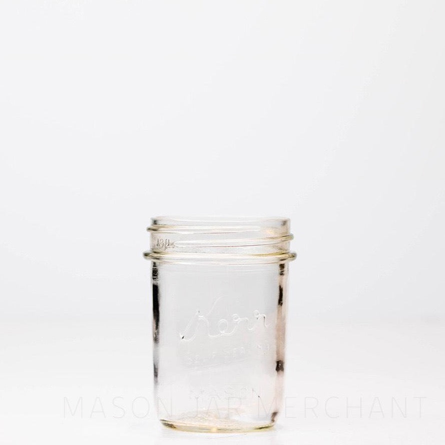 regular mouth half pint mason jar with a Kerr logo on the front against a white background
