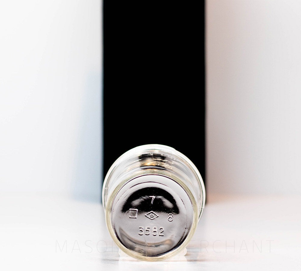 bottom of a Regular mouth half pint mason jar with straight sides against a white background