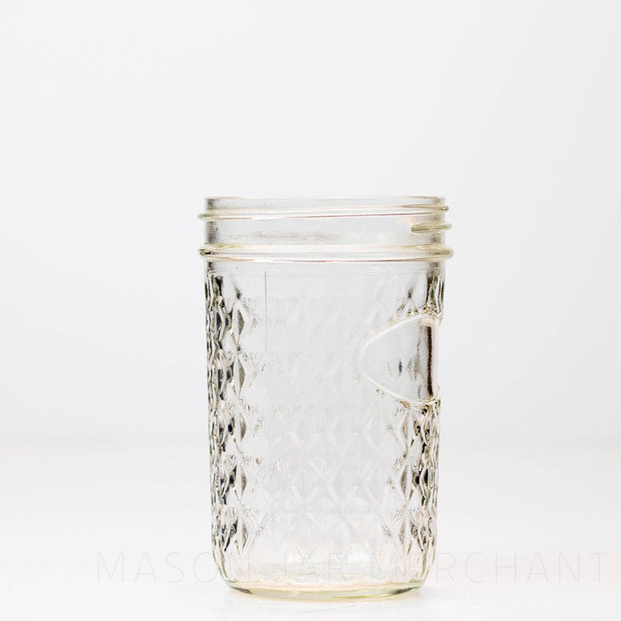 quilted wide mouth glass mason jar on a black and white background