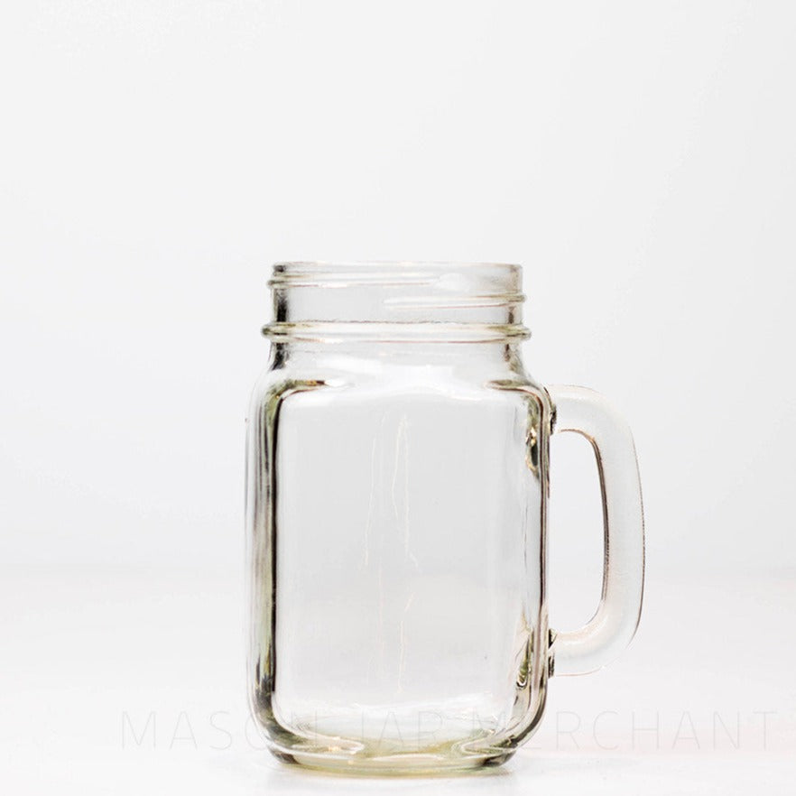 Regular mouth pint mason jar mug against a white background