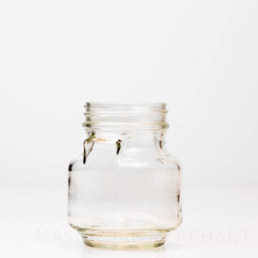 Regular mouth pint mason jar with unique pinched &quot;shoulders&quot; and no logo, against a white background