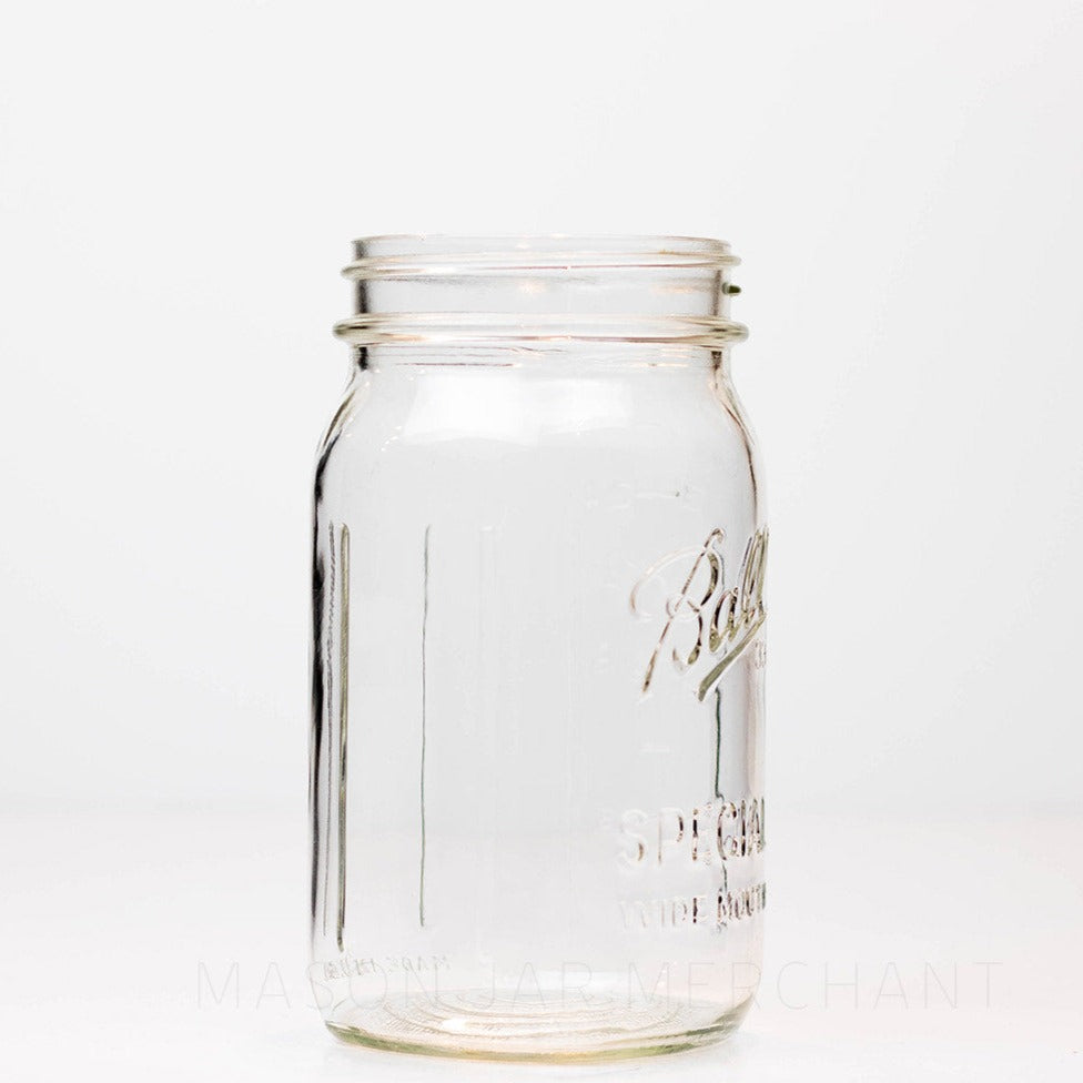 Side view of a Wide mouth quart mason jar with Ball Special logo, against a white background