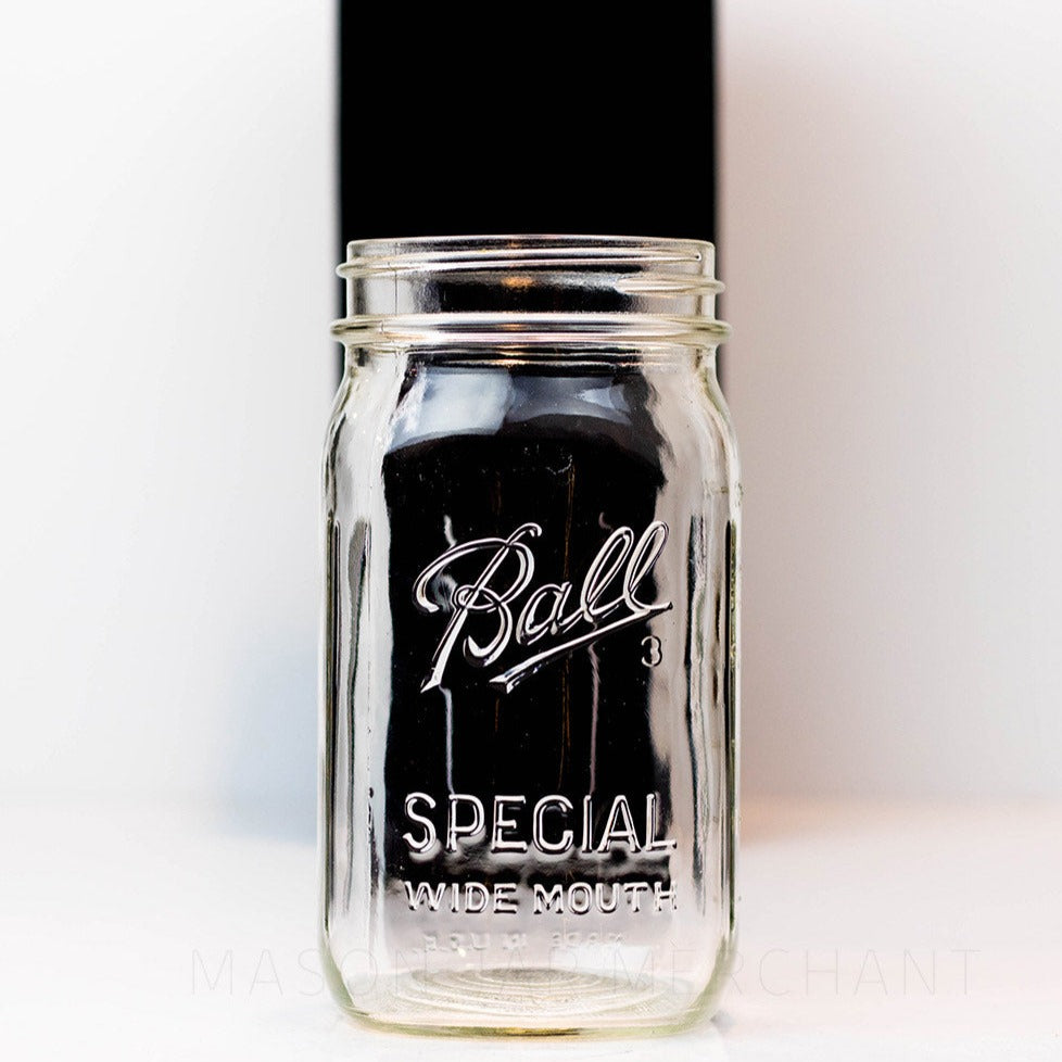 Close up of a Wide mouth quart mason jar with Ball Special logo, against a white background