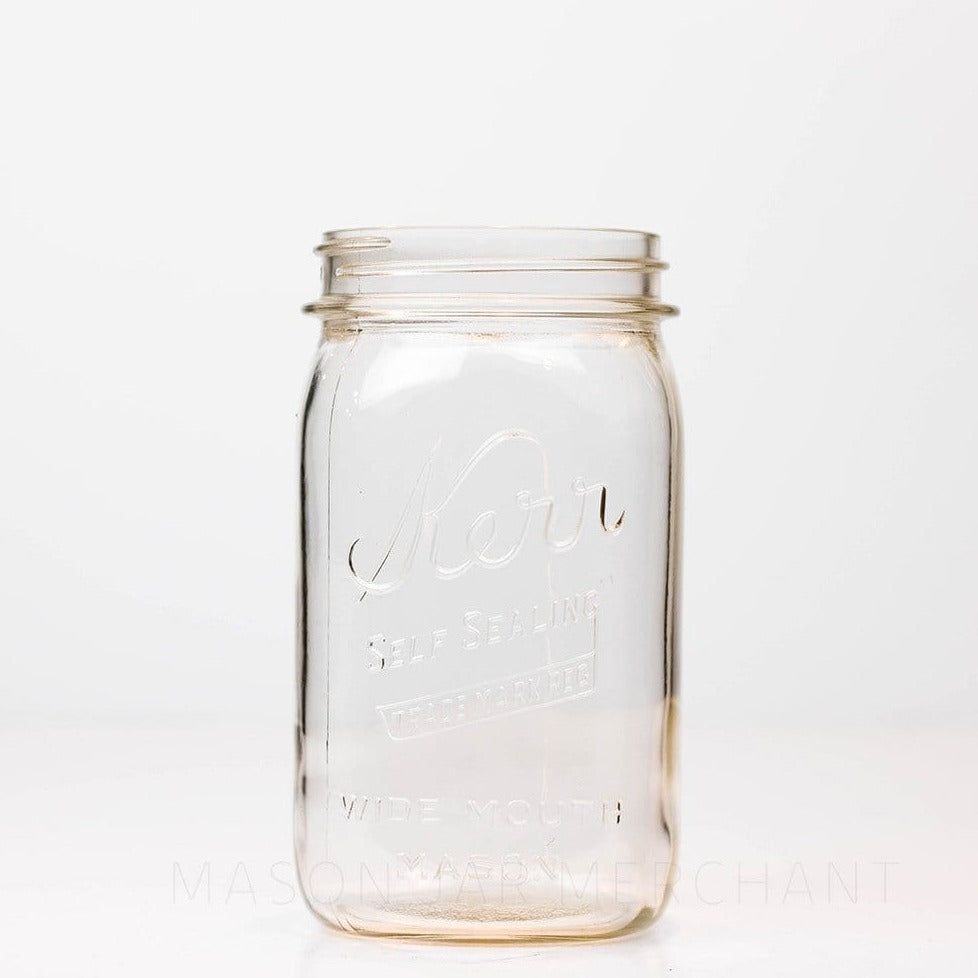 Wide mouth quart mason jar with Kerr self-sealing logo, against a white background 