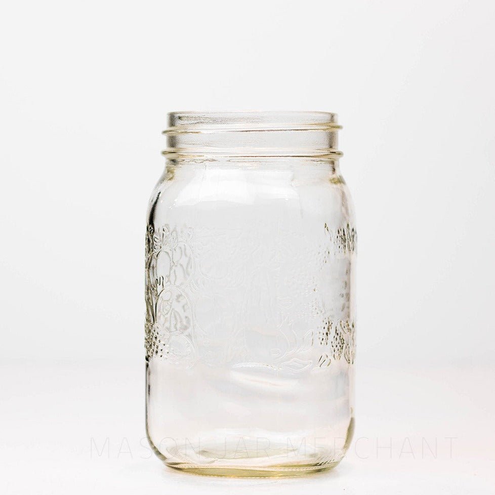 Wide mouth quart mason jar with a fruity pattern against a white background