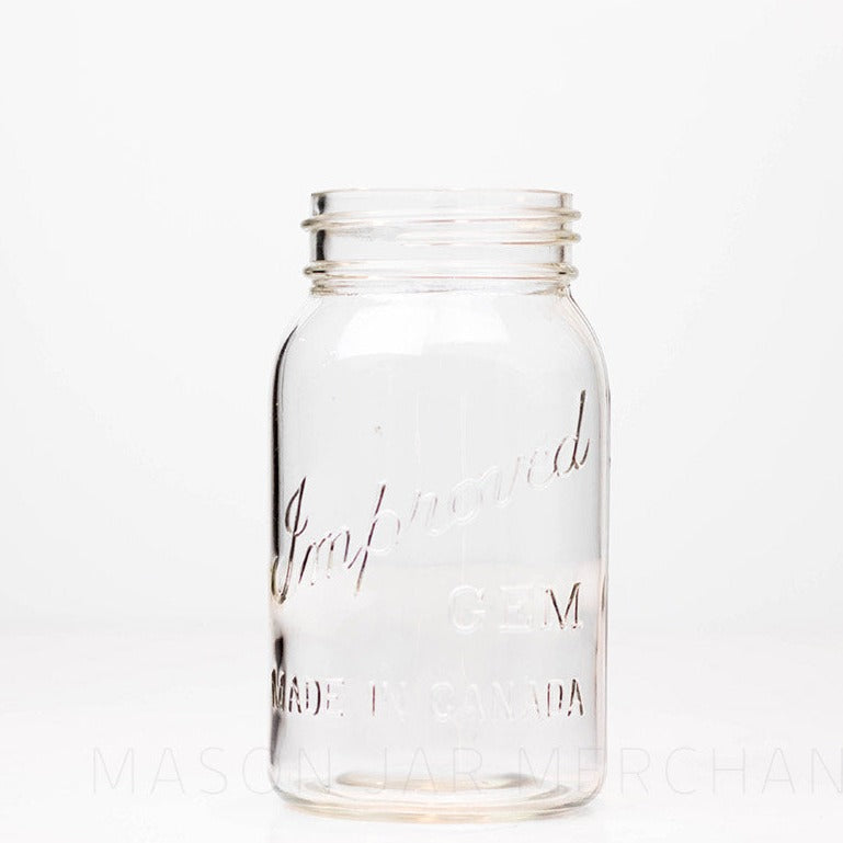 Vintage Improved Gem quart mason jar against a white background