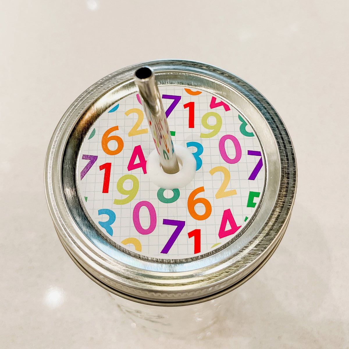 Patterned Mason Jar Straw Lid with Rainbow Numbers on Graph Paper design