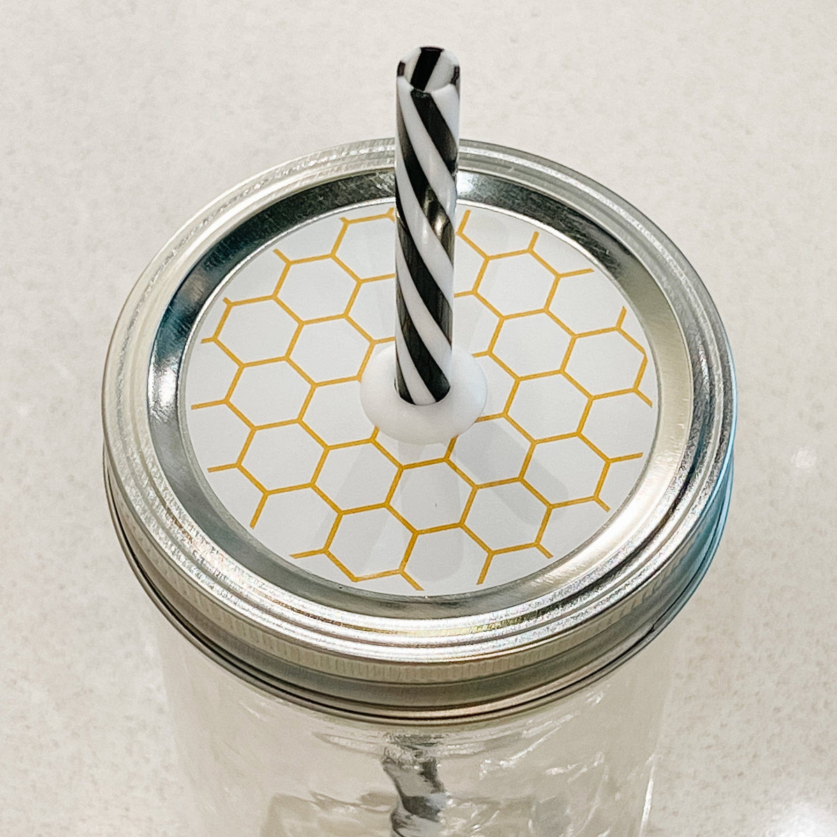 top photo of mason jar lid with honeycomb design