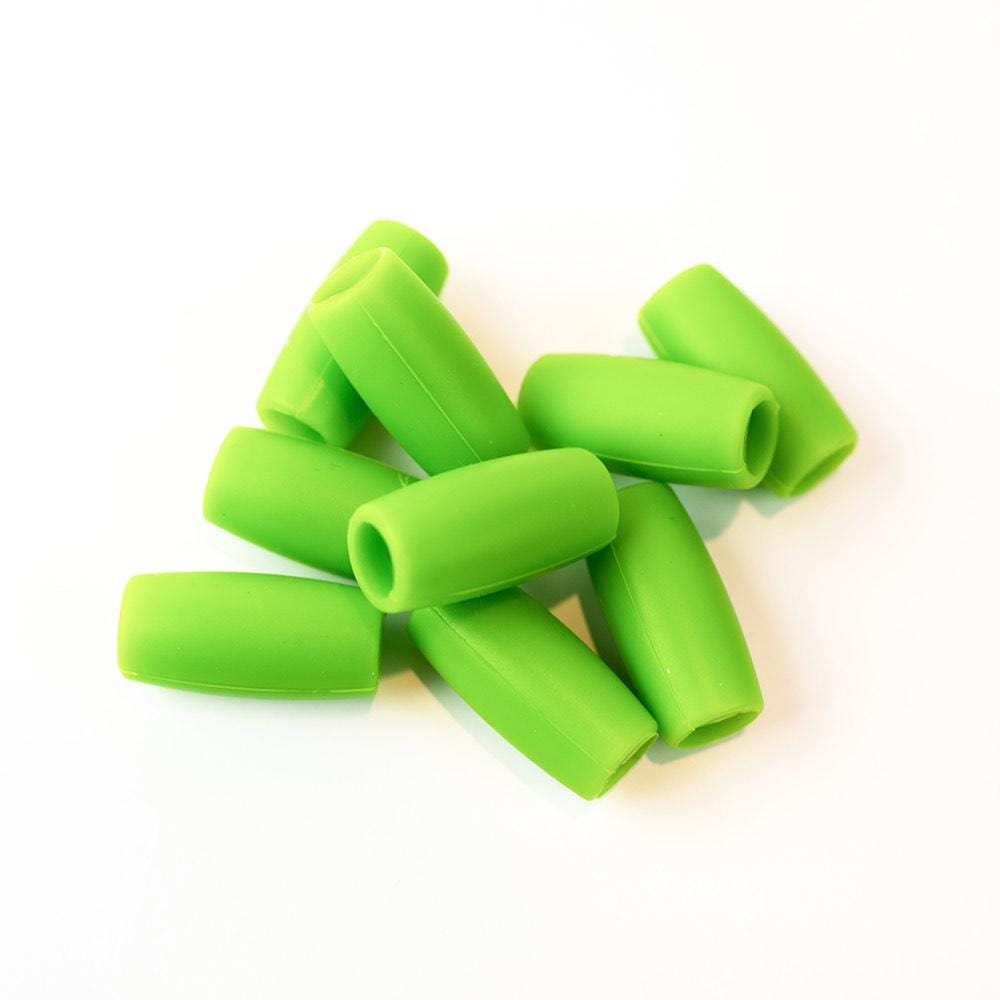 Green silicone straw tips for stainless steel straws, set against a white background