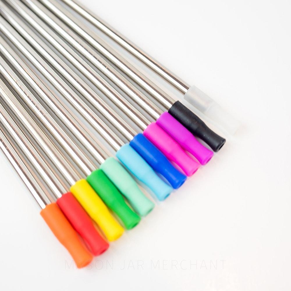 Close-up of silicone straw tips on stainless steel straws against a white background 