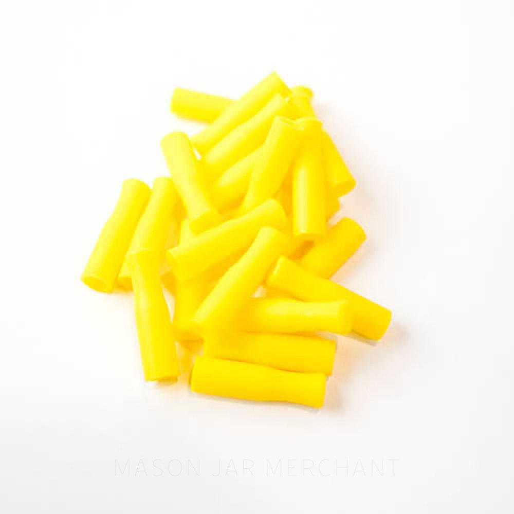 Yellow silicone straw tips for stainless steel straws, set against a white background.