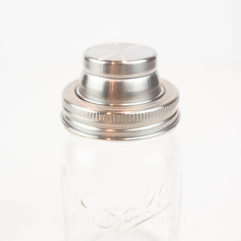 Vintage glass cocktail shaker with metal lid and screw off..