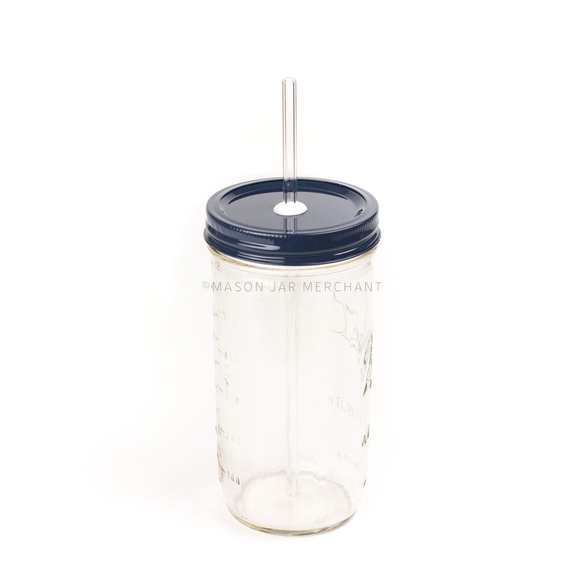 Close-up of a 24 oz mason jar with a navy custom painted lid with a white silicone grommet and a glass straw, against a white background
