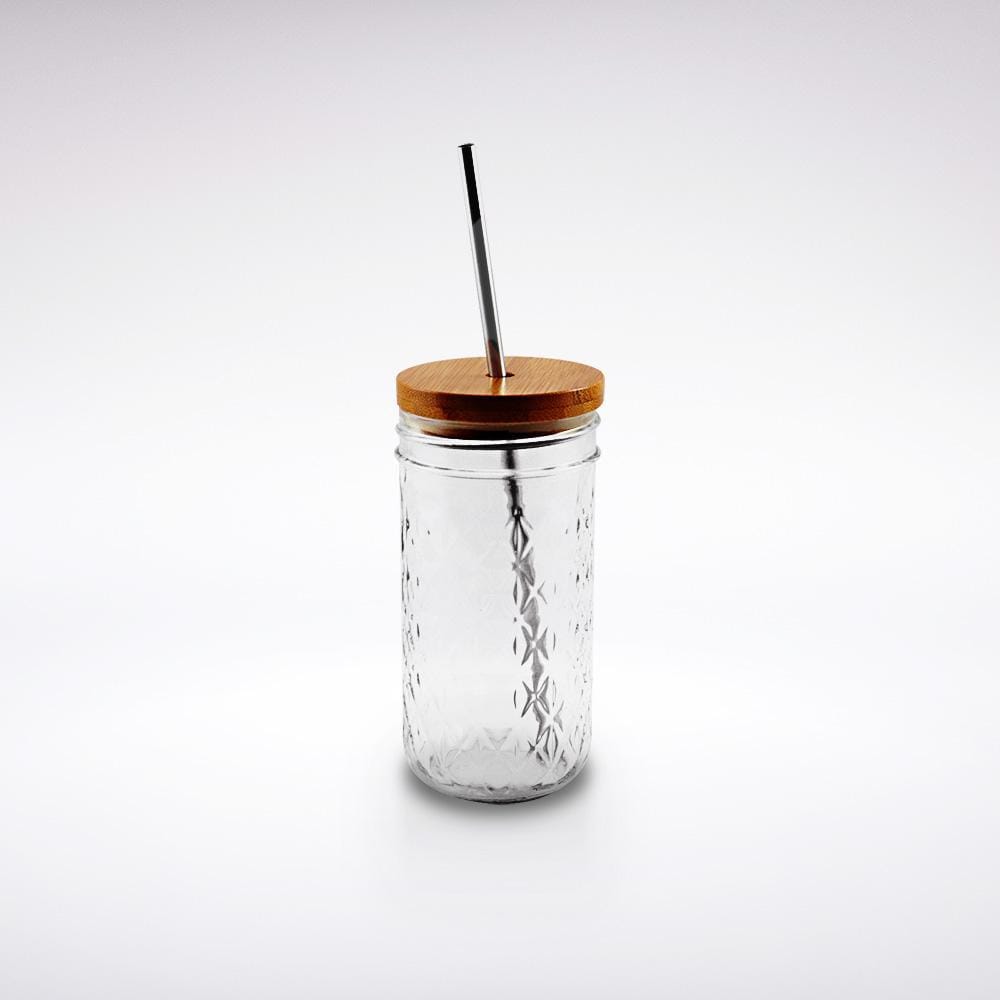 A regular mouth reusable glass mason jar with a bamboo straw lid and a silver stainless steel reusable straw