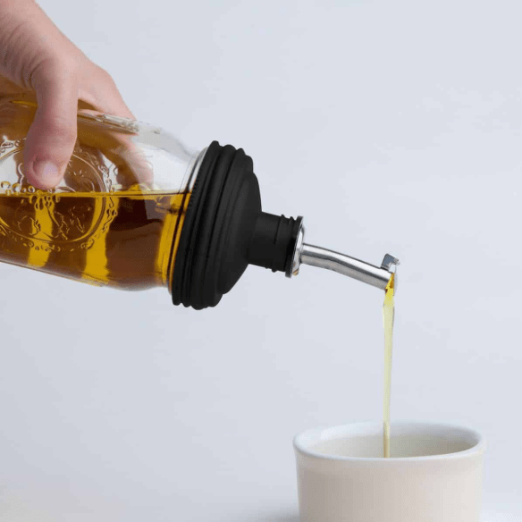 A reCAP 'ADAPTA' Pour Tap - Mason Jar Pour Tap Lid used as an oil dispenser