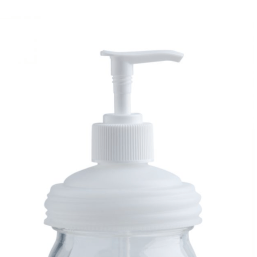 a white reCap mason jar pump lid on a regular mouth jar on a white background