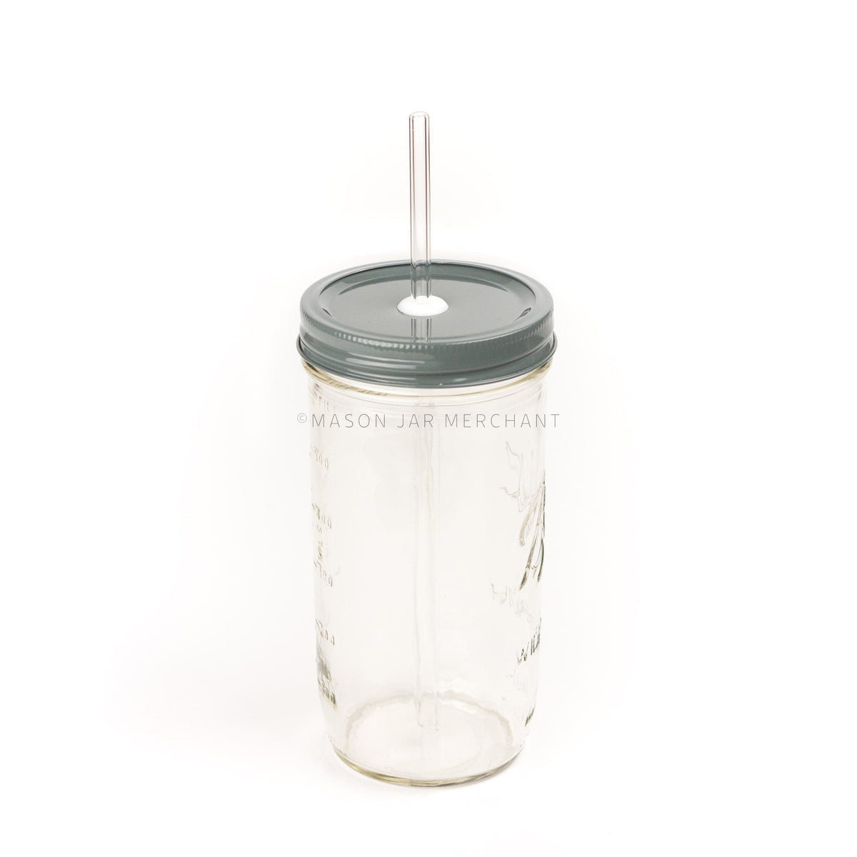 A 24 oz wide mouth mason jar with a dark gray custom painted lid with a white silicone grommet and a glass straw, against a white background