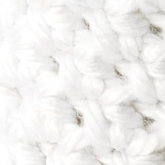 Close up of a white knit cozy jar covers
