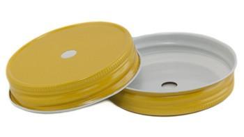 Close up of two yellow one piece wide mouth straw lids on a white background