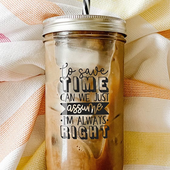 Tumbler with iced coffee with print that says "To save time, can just assume I'm always right." Photographed against a striped picnic cloth.