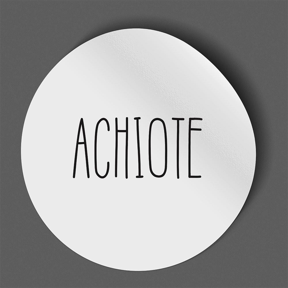 Waterproof label for achiote. Photographed against a gray background.