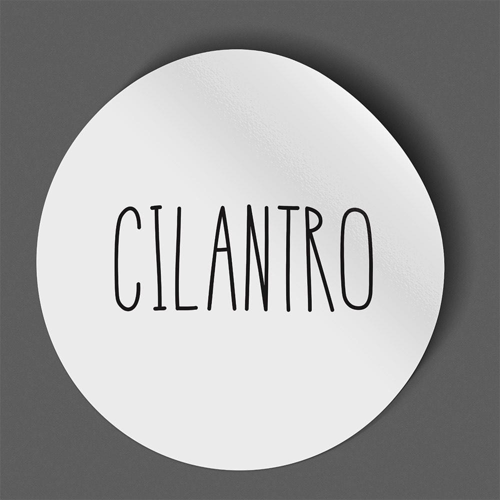 Waterproof label for cilantro. Photographed against a gray background.