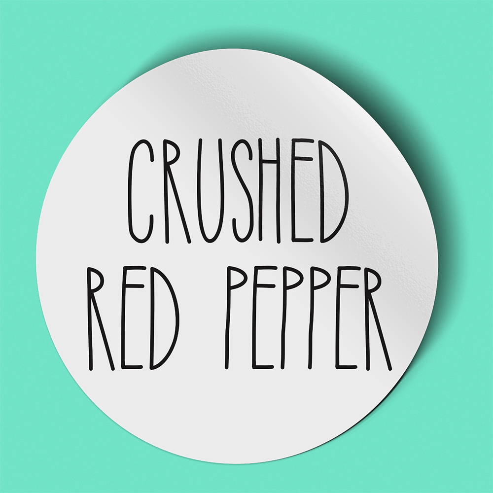 Waterproof label for crushed red pepper. Photographed against a light green background.