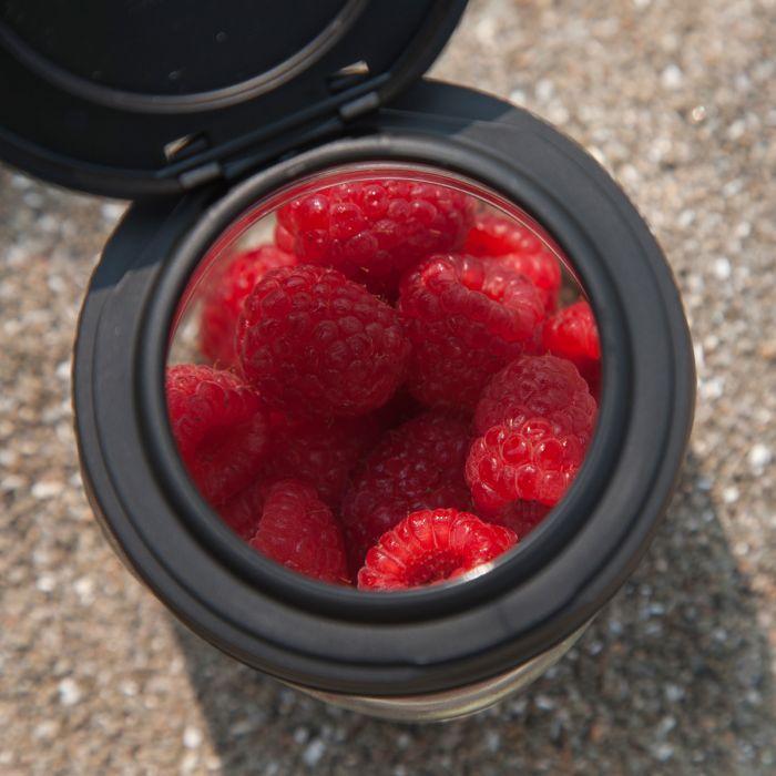 Black reCAP flip cap or mason jar flip top lid with berries inside.