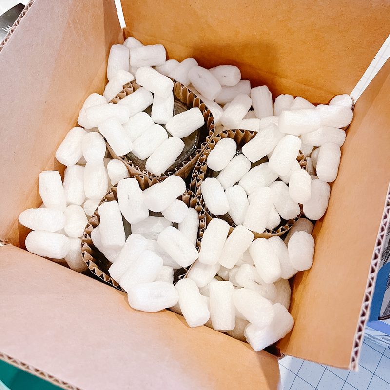 Box filled with white packing peanuts